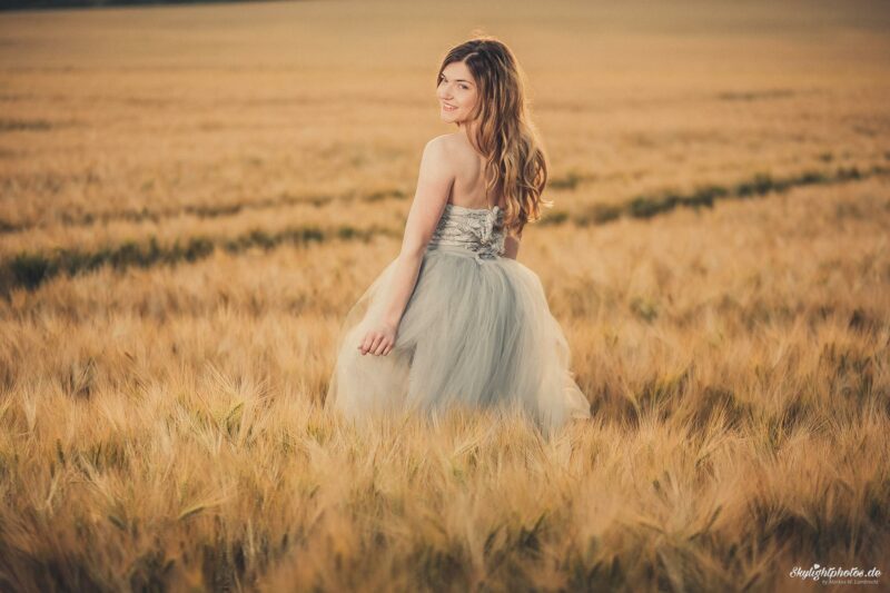 Girl on the field in the sunset